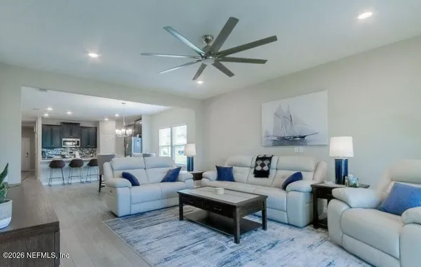 a kitchen with granite countertop a sink stove and cabinets