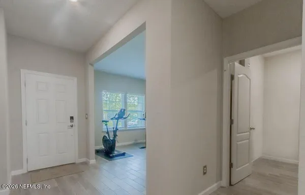 a living room with furniture and a bookshelf