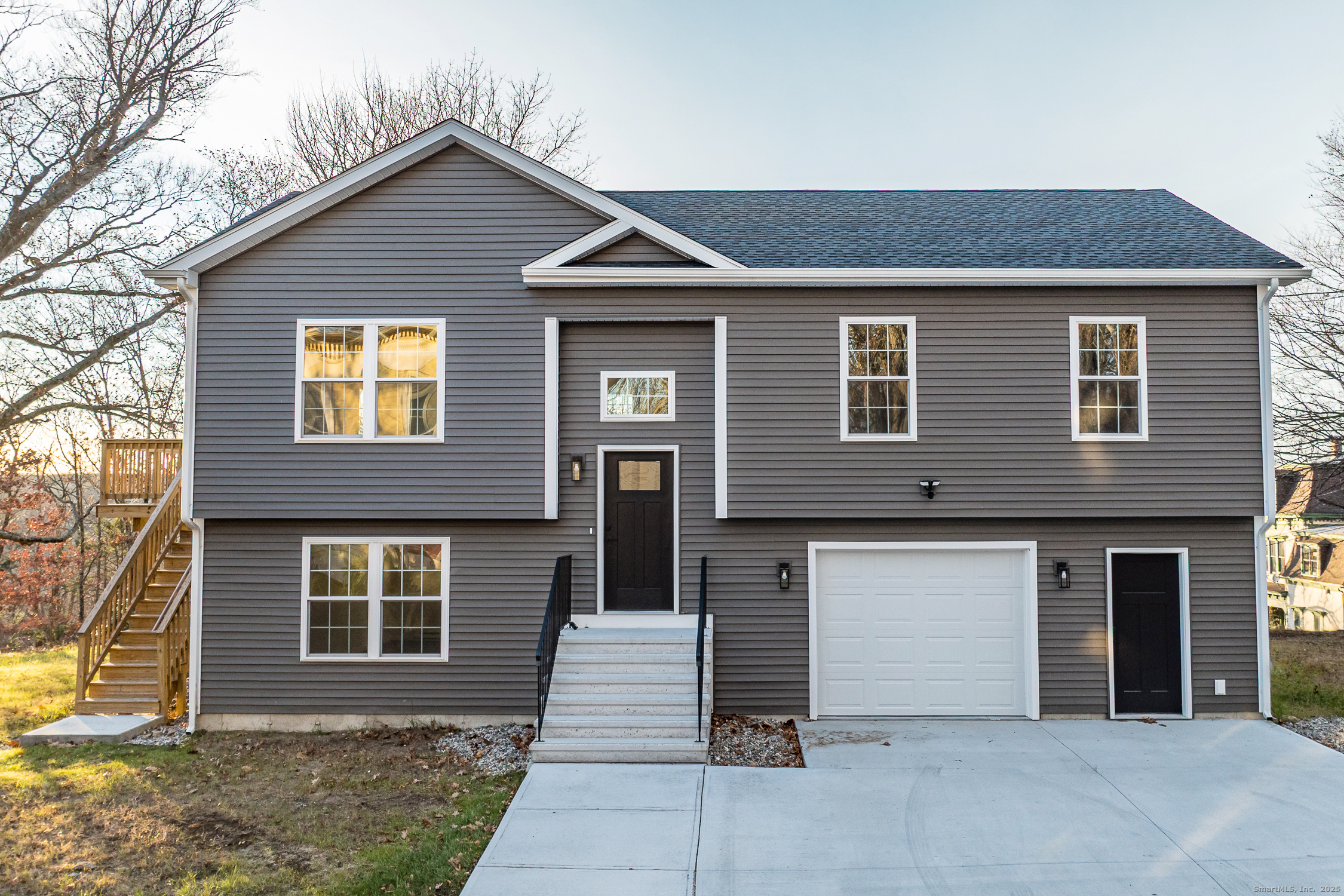 a front view of a house with a garage