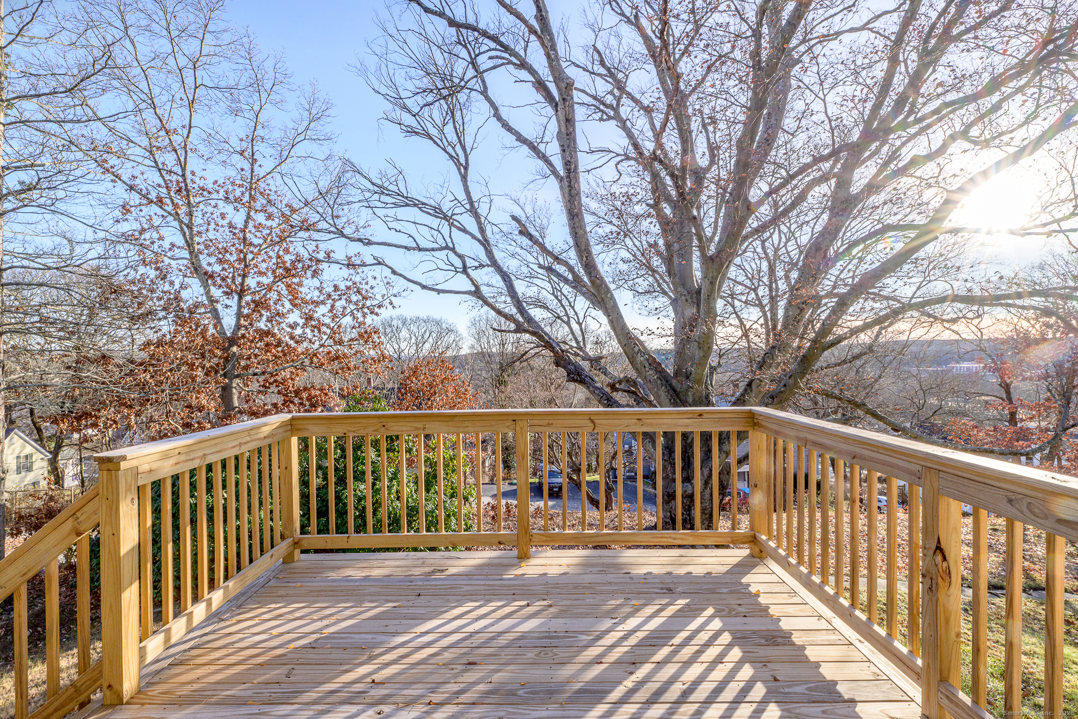6 Prospect Street Putnam, CT 06260 - Photo 12 of 40 a balcony with wooden floor and fence