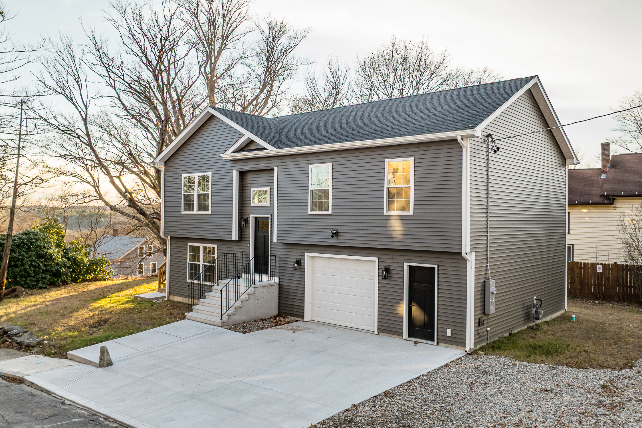 6 Prospect Street Putnam, CT 06260 - Photo 2 of 40 a front view of a house with garden