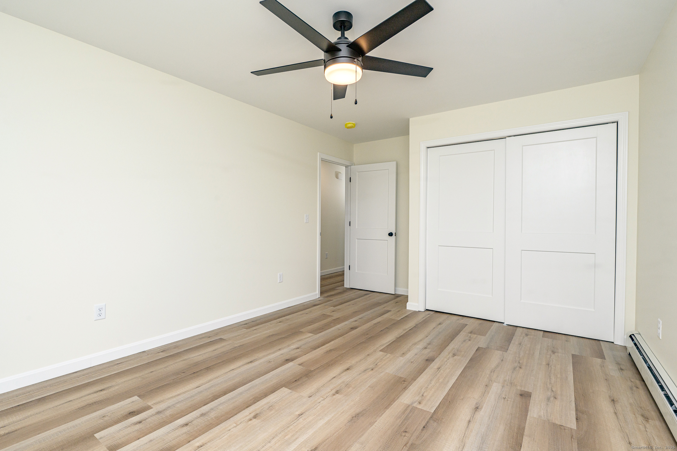 6 Prospect Street Putnam, CT 06260 - Photo 23 of 40 wooden floor in an empty room