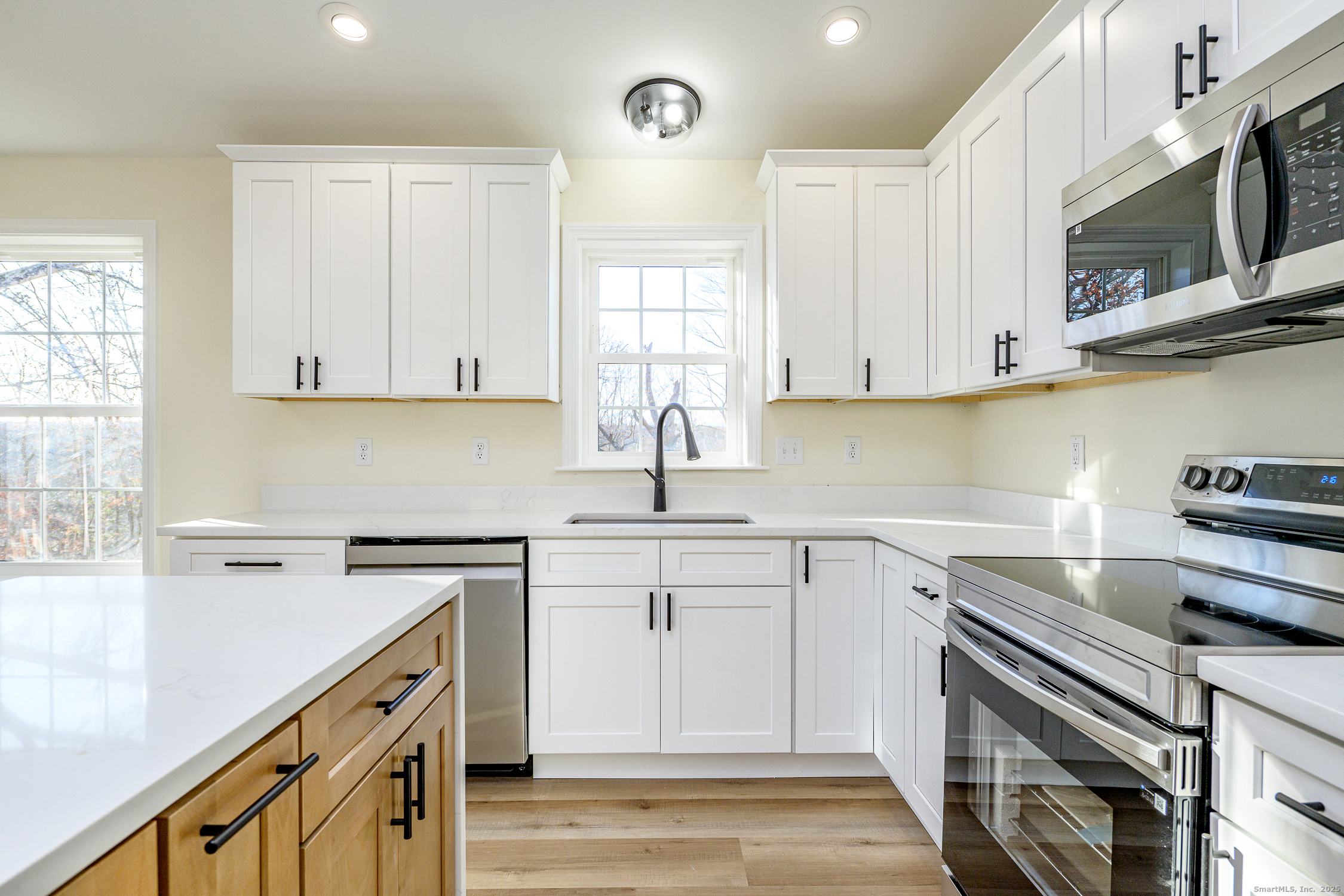 6 Prospect Street Putnam, CT 06260 - Photo 9 of 40 a kitchen with cabinets appliances a sink and a window