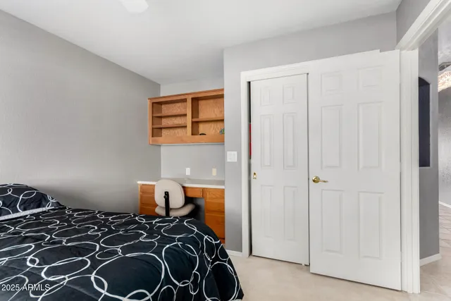 a bedroom with a bed and a closet