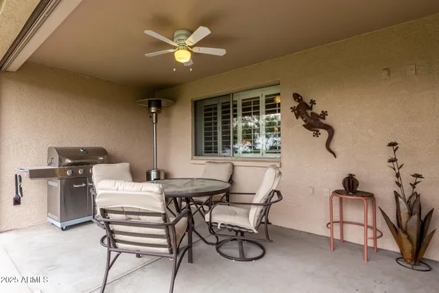 a dining room with furniture and window