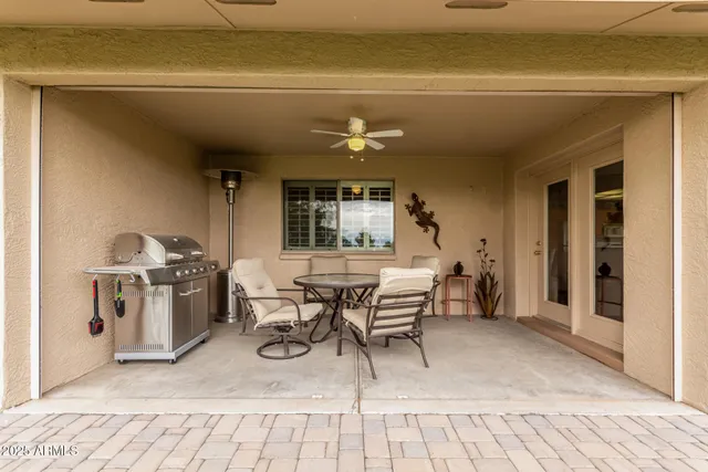 a view of a dining room with furniture and a window