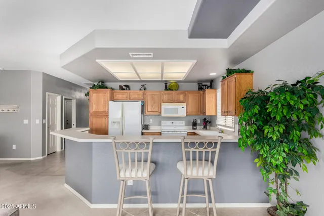 a view of a dining room with furniture and window
