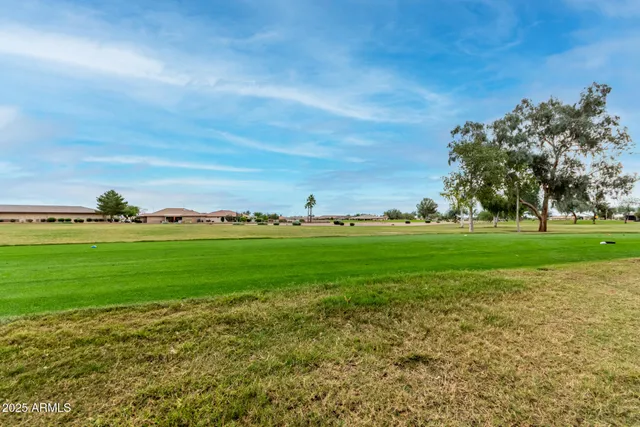a view of a golf course with a lake