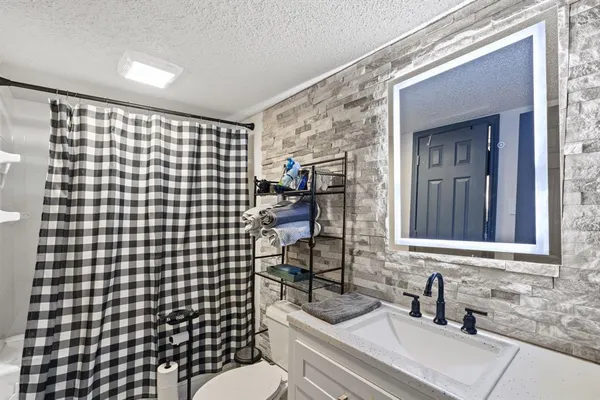 a bedroom with furniture and a gym equipment