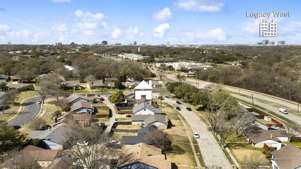 an aerial view of residential building with parking space