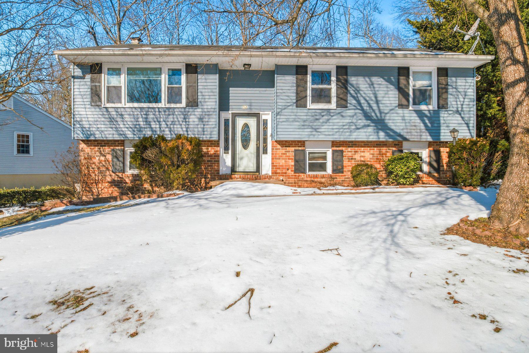 7526 Lemon Tree Court Hanover, MD 21076 - Photo 1 of 27 a front view of a house with a yard