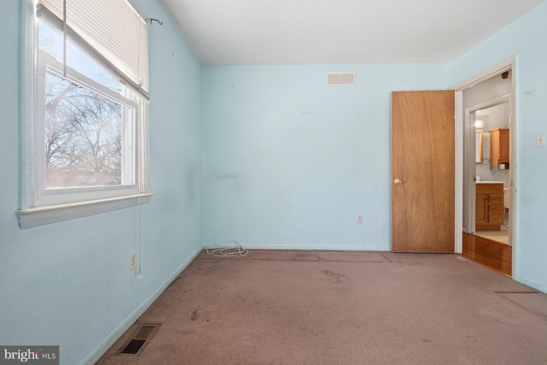 7526 Lemon Tree Court Hanover, MD 21076 - Photo 18 of 27 a view of an empty room with a window