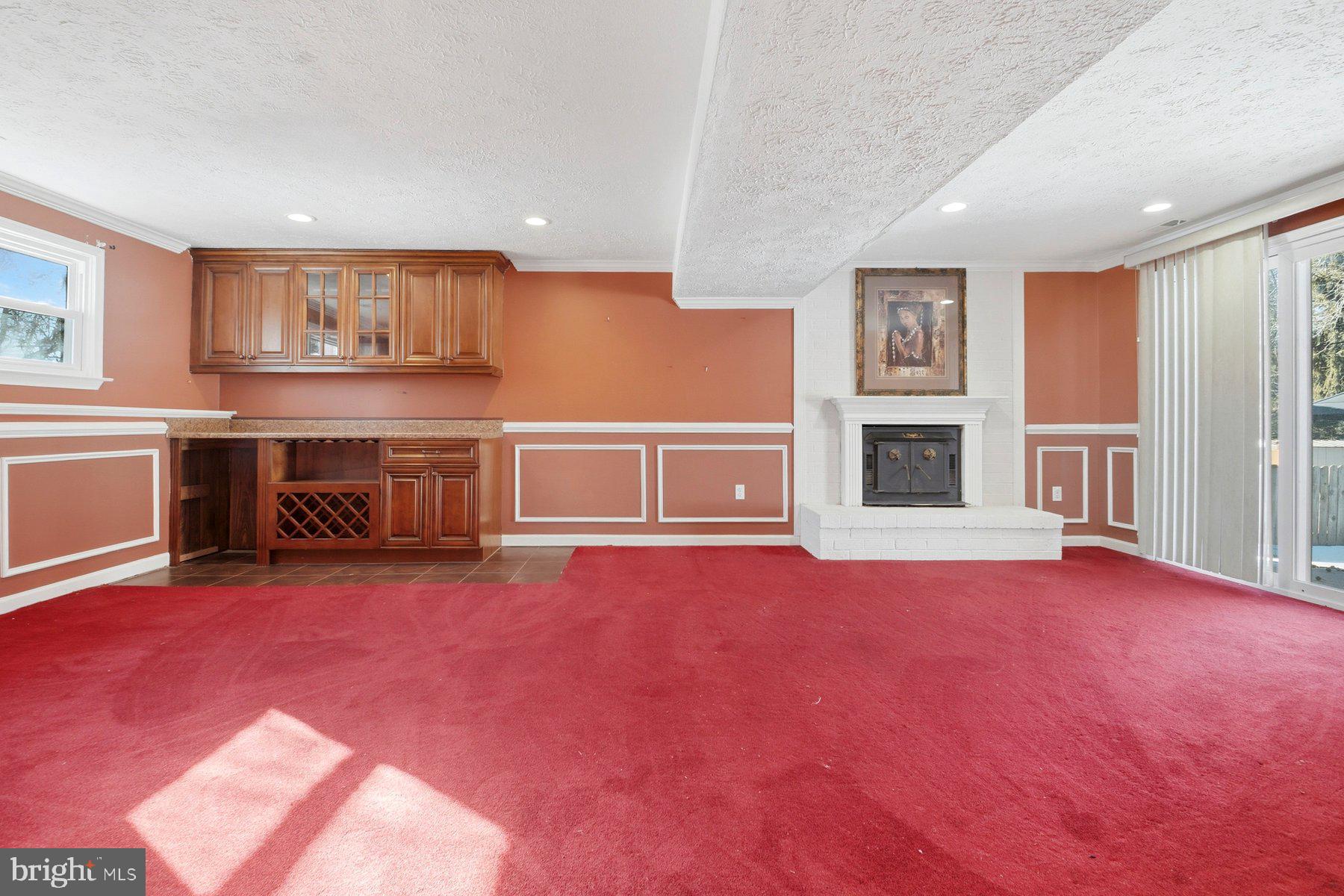 7526 Lemon Tree Court Hanover, MD 21076 - Photo 19 of 27 a view of an empty room with window and fire place