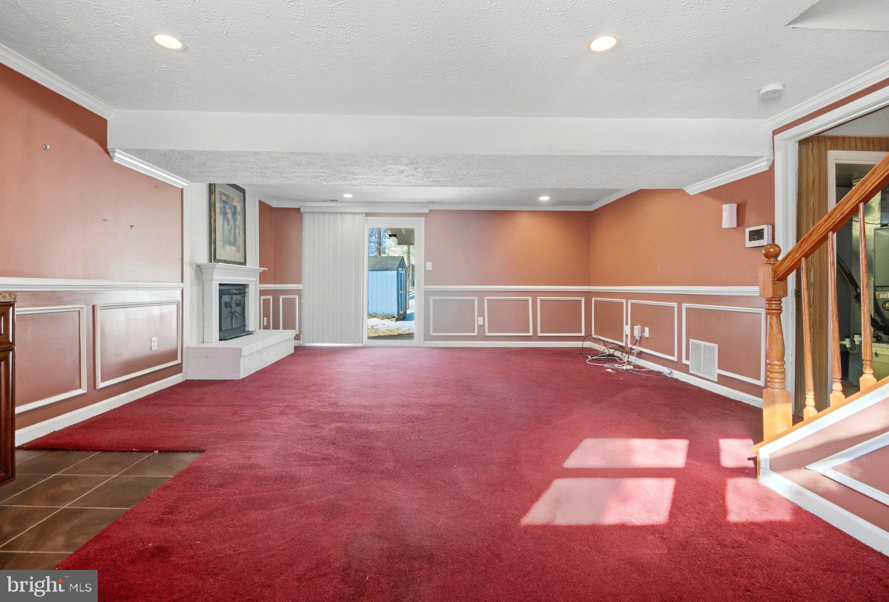 7526 Lemon Tree Court Hanover, MD 21076 - Photo 20 of 27 a view of an empty room with window and stairs