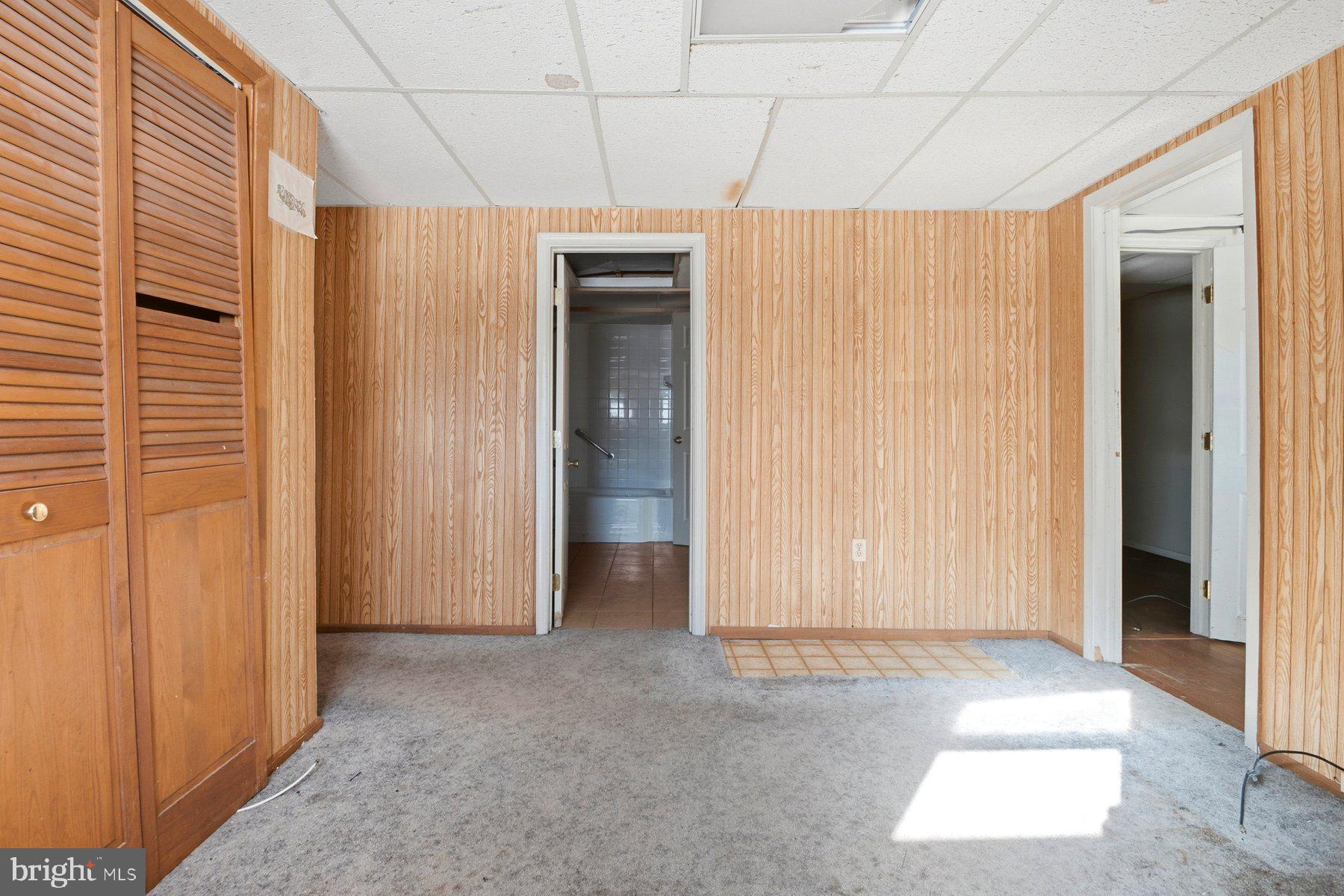 7526 Lemon Tree Court Hanover, MD 21076 - Photo 22 of 27 a view of a room with a wooden door