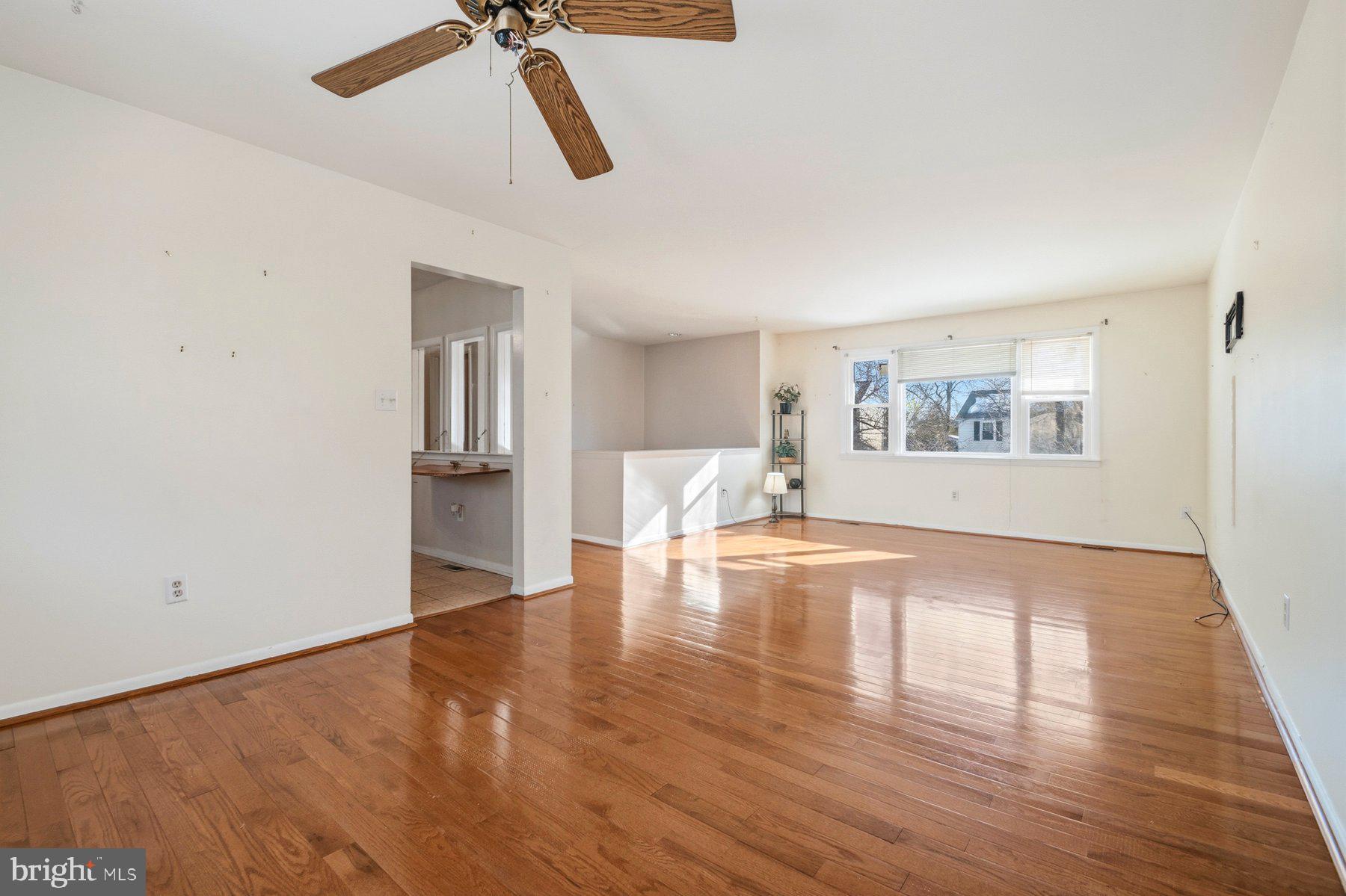 7526 Lemon Tree Court Hanover, MD 21076 - Photo 6 of 27 a view of empty room with wooden floor