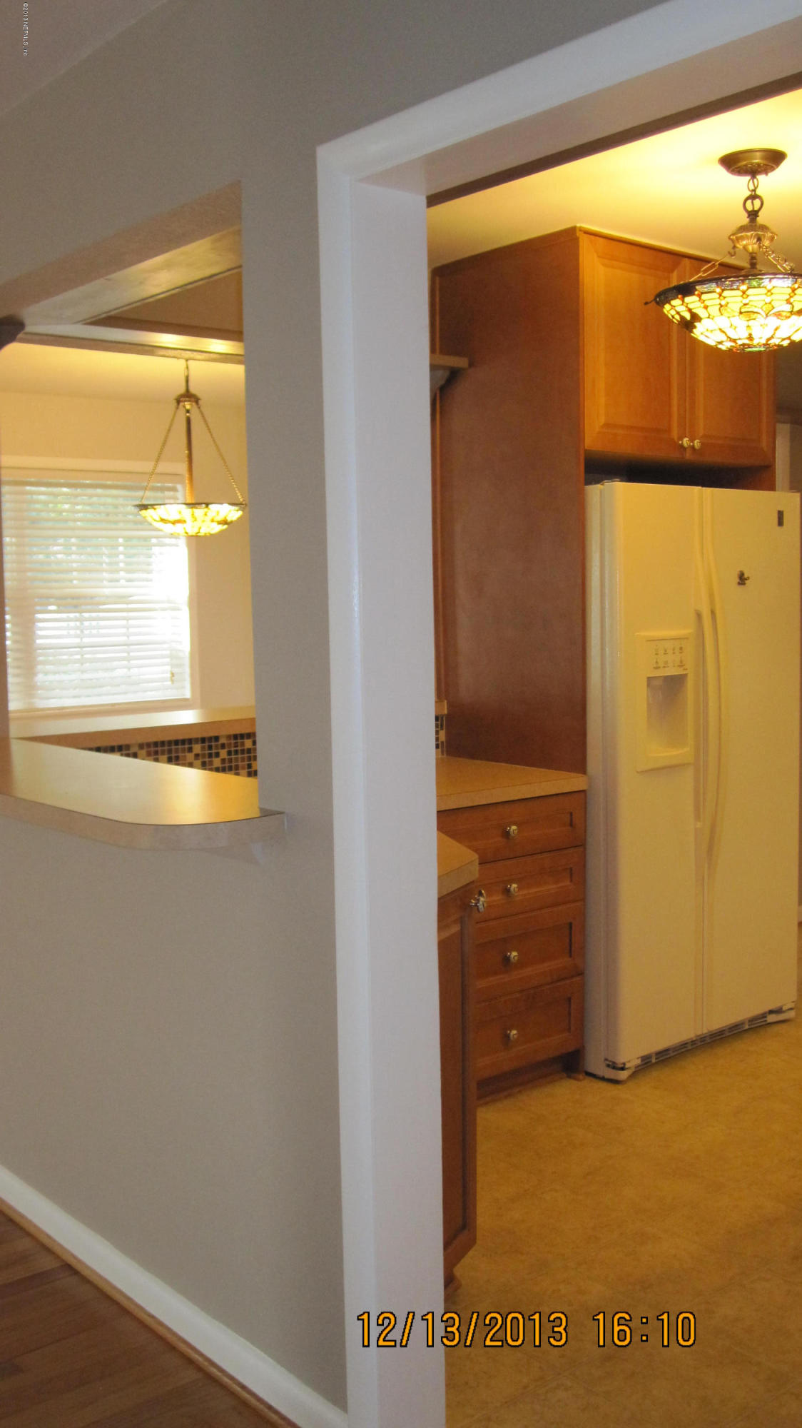 7236 Coligny Road Jacksonville, FL 32217 - Photo 13 of 45 a view of walk in closet with window