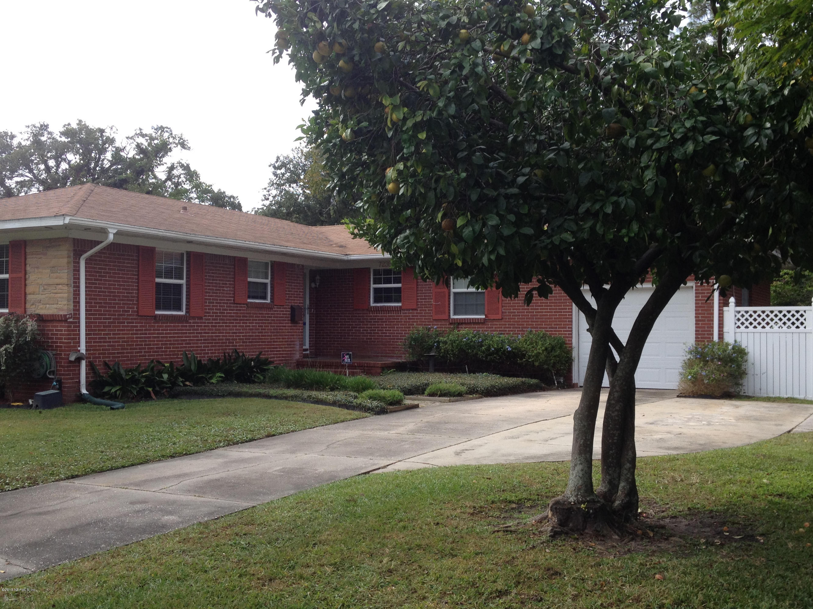 7236 Coligny Road Jacksonville, FL 32217 - Photo 3 of 45 a front view of a house with yard
