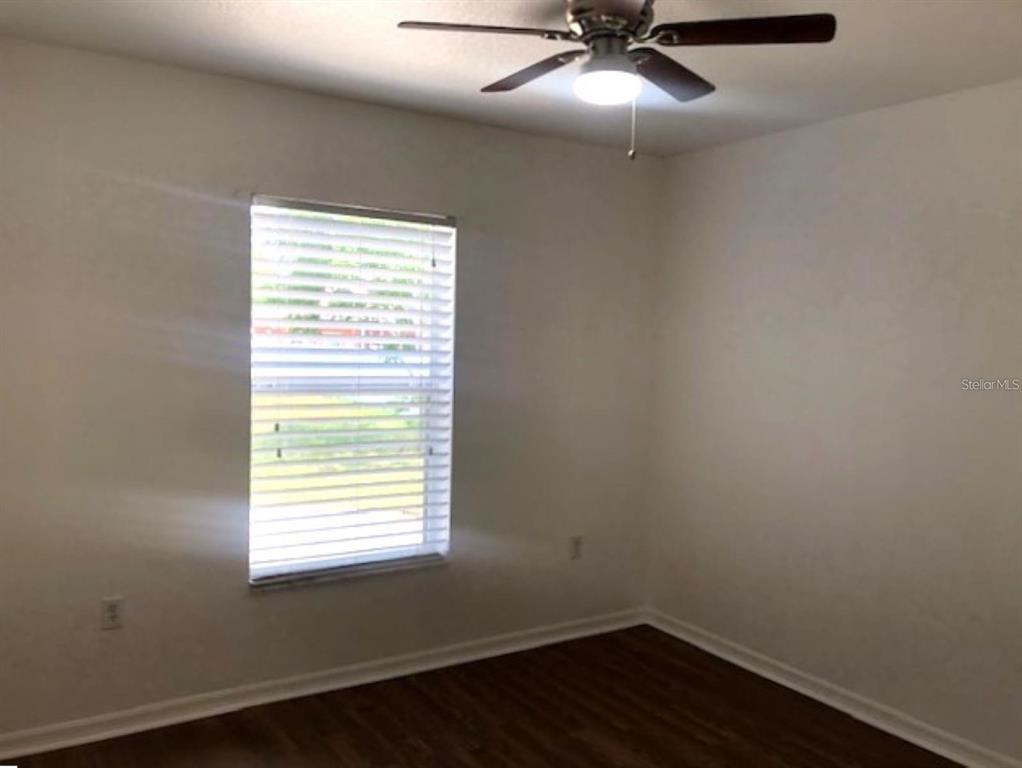 4955 Southwest 129th Place Ocala, FL 34473 - Photo 13 of 19 an empty room with a window