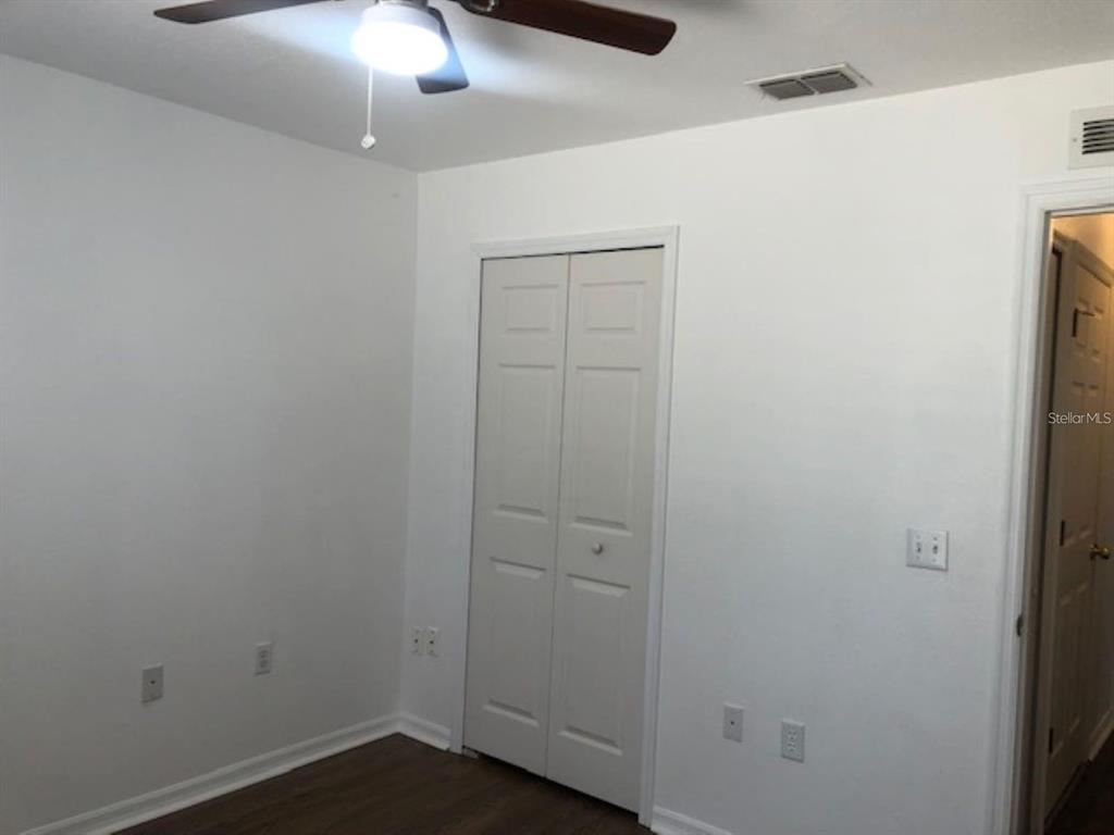 4955 Southwest 129th Place Ocala, FL 34473 - Photo 14 of 19 wooden floor in an empty room