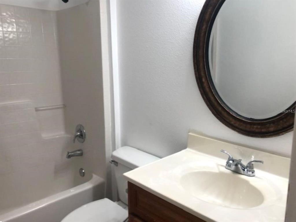 4955 Southwest 129th Place Ocala, FL 34473 - Photo 15 of 19 a bathroom with a sink toilet and shower