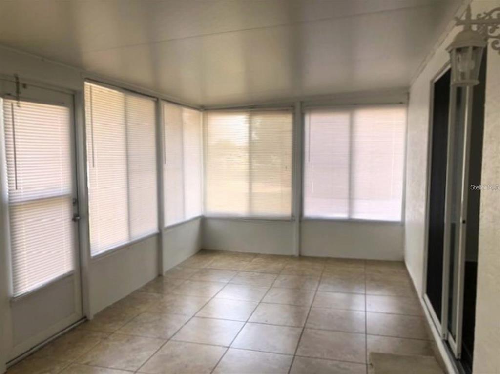 4955 Southwest 129th Place Ocala, FL 34473 - Photo 17 of 19 a view of an empty room with a window