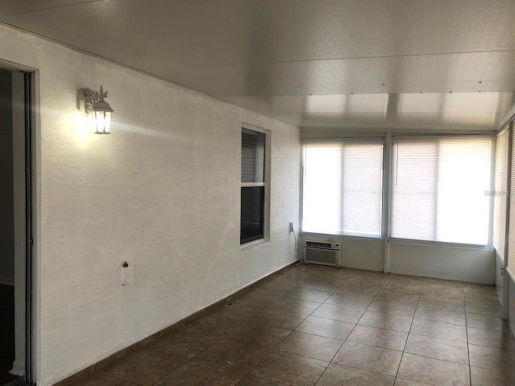 4955 Southwest 129th Place Ocala, FL 34473 - Photo 18 of 19 a view of an empty room with a window