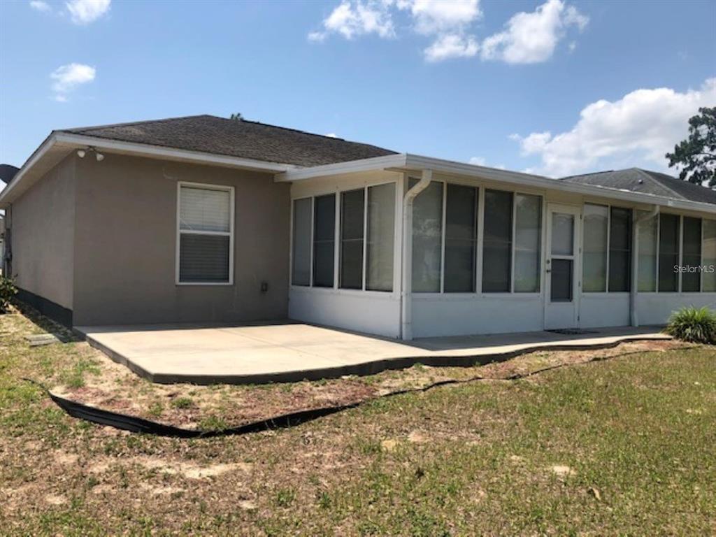 4955 Southwest 129th Place Ocala, FL 34473 - Photo 19 of 19 a view of outdoor space yard and front view of a house