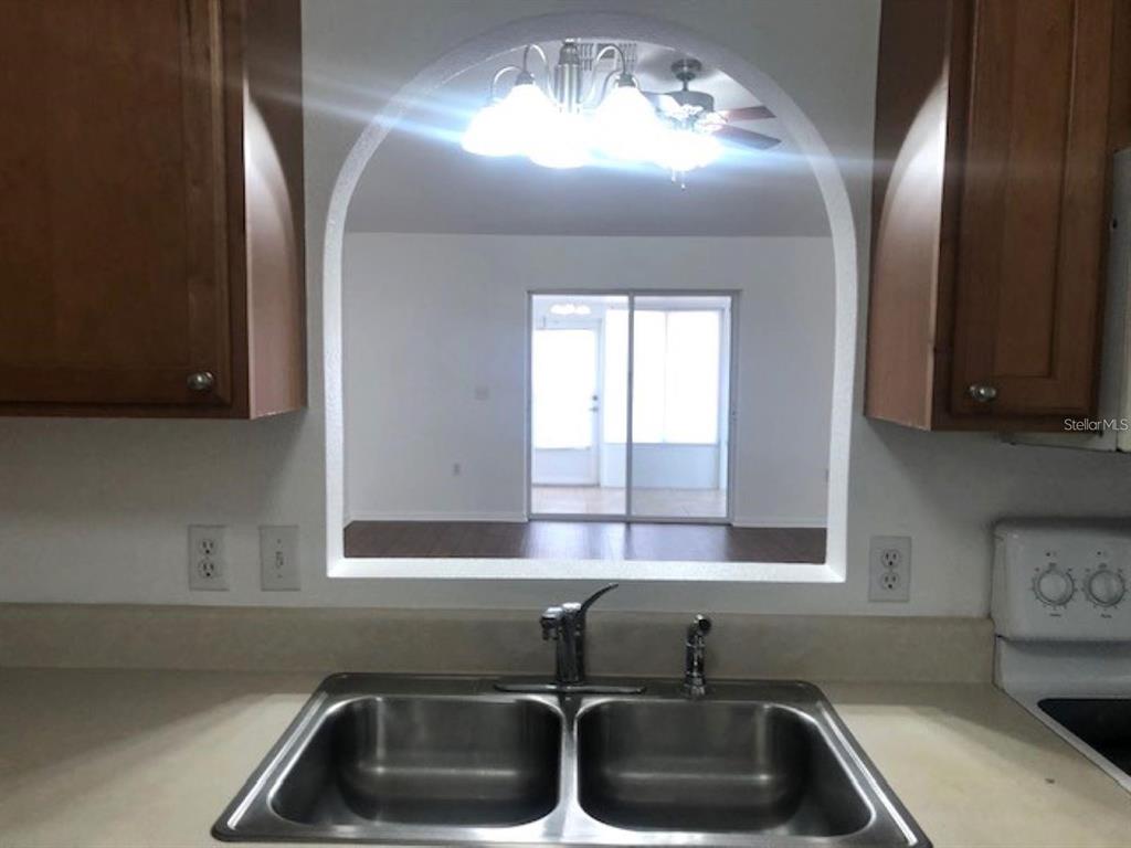 4955 Southwest 129th Place Ocala, FL 34473 - Photo 6 of 19 a kitchen with a sink and a window
