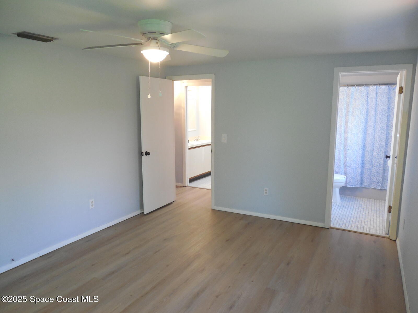 345 Ocean View Lane Indialantic, FL 32903 - Photo 13 of 31 wooden floor in an empty room with a window