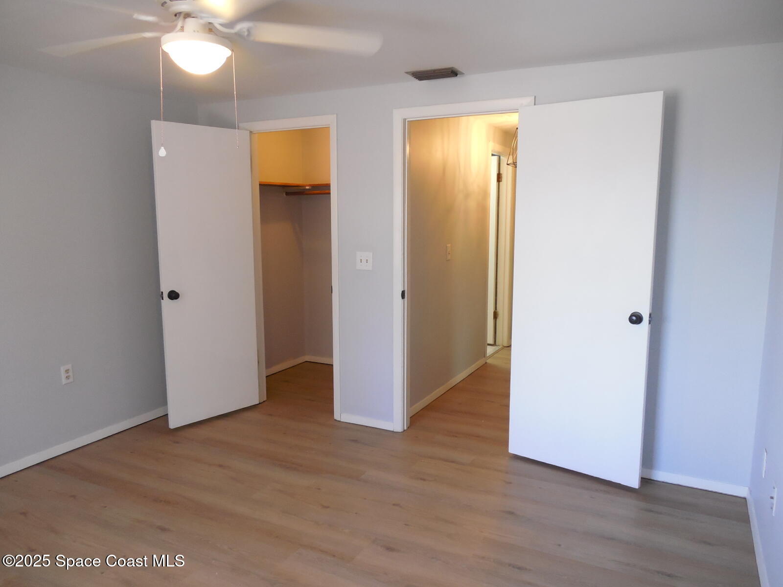 345 Ocean View Lane Indialantic, FL 32903 - Photo 17 of 31 a view of an empty room with wooden floor and a window