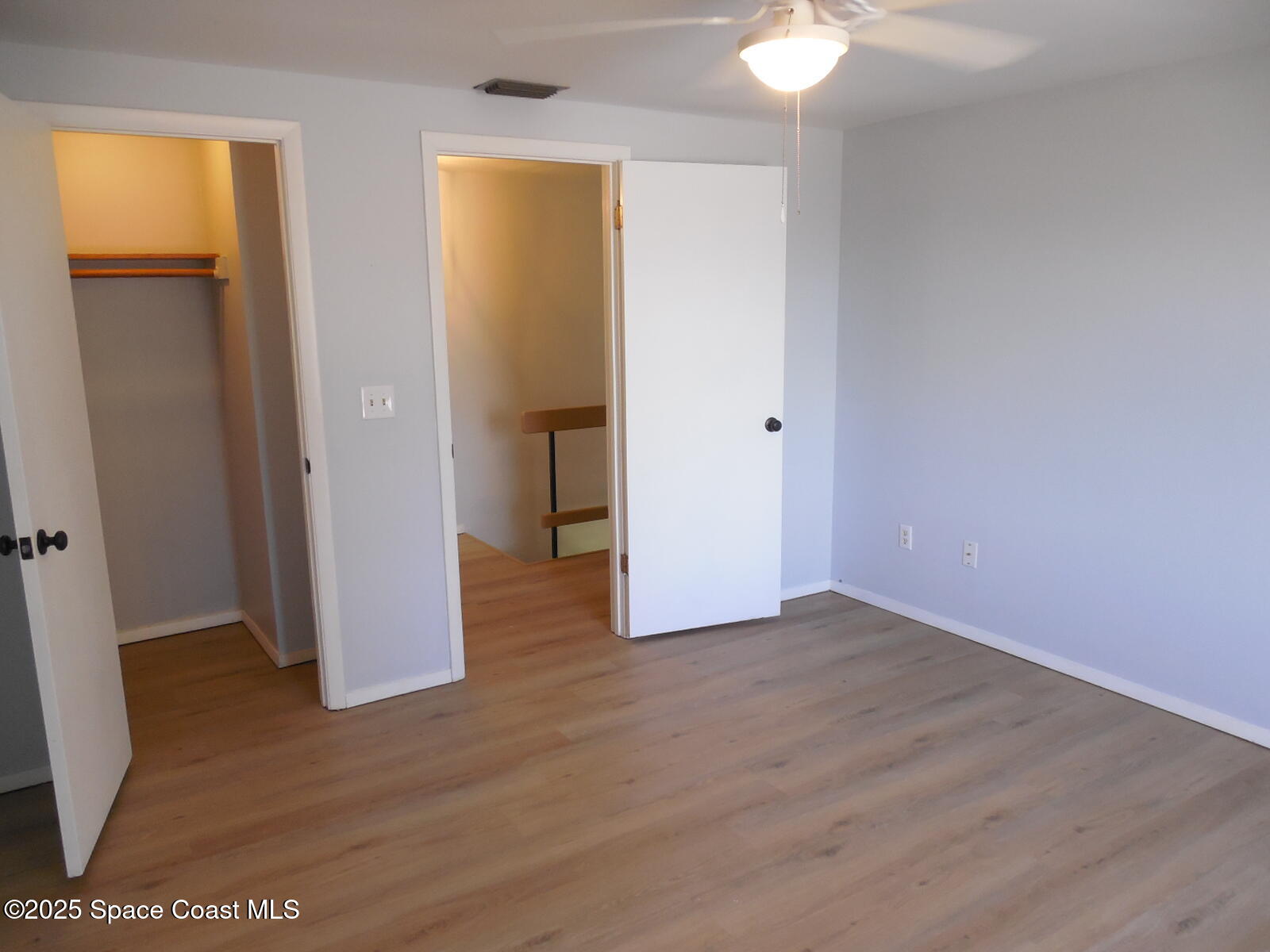 345 Ocean View Lane Indialantic, FL 32903 - Photo 18 of 31 an empty room with wooden floor and closet