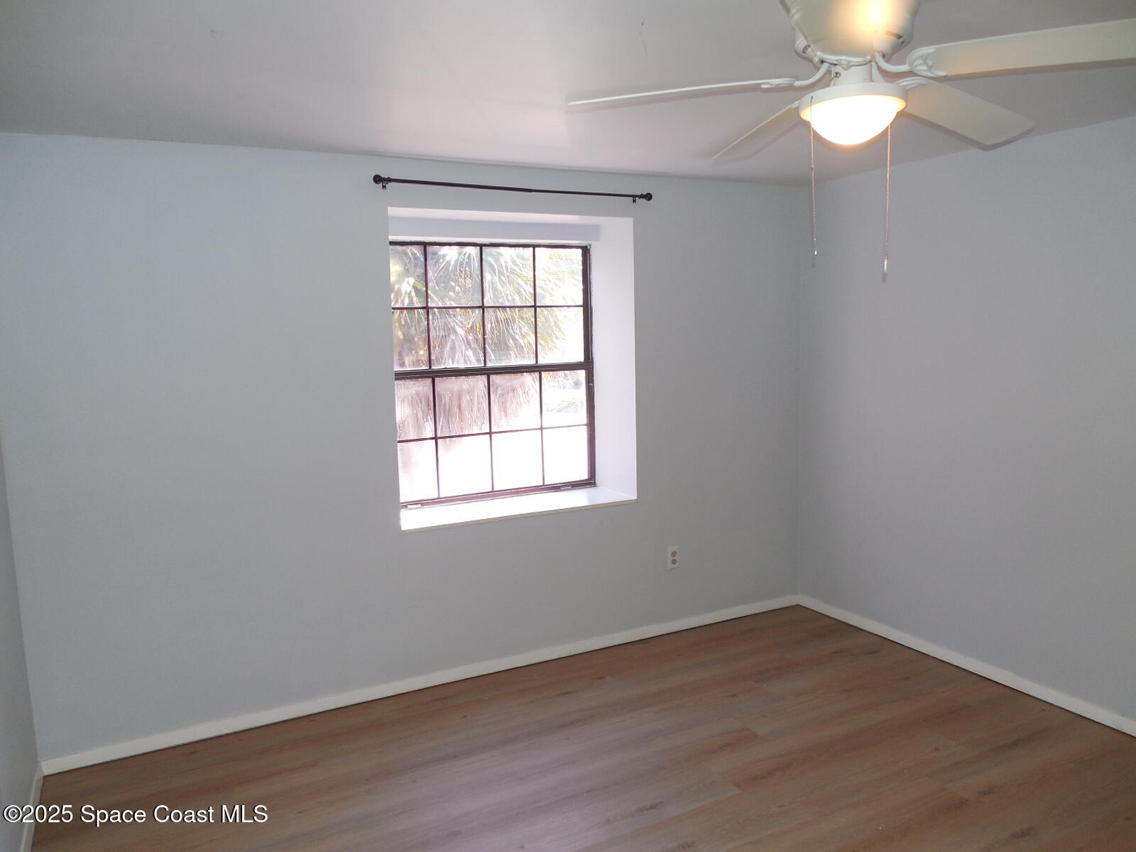 345 Ocean View Lane Indialantic, FL 32903 - Photo 22 of 31 wooden floor in an empty room with a window