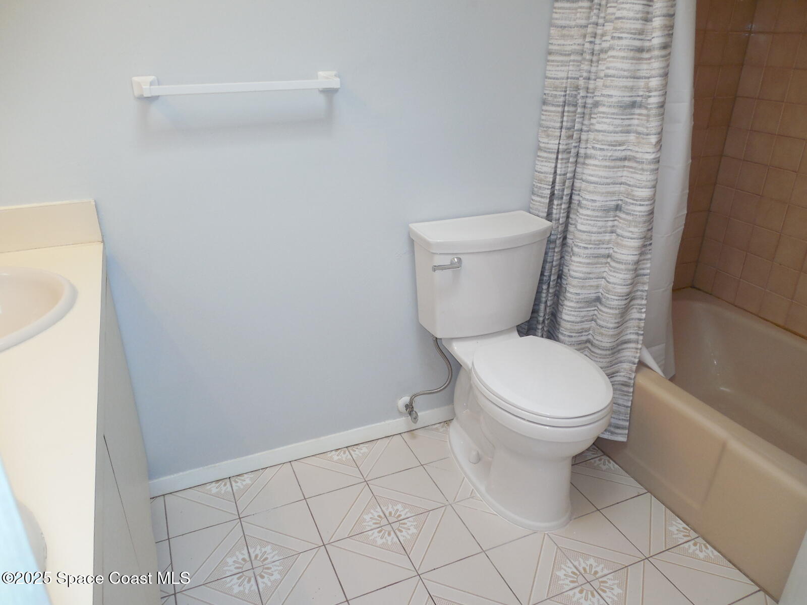 345 Ocean View Lane Indialantic, FL 32903 - Photo 27 of 31 a white toilet sitting next to a white sink
