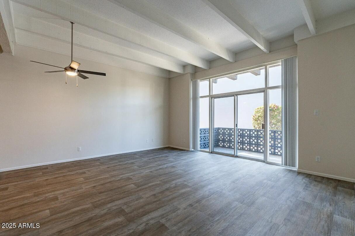 5128 North 15th Street, Unit 1 Phoenix, AZ 85014 - Photo 2 of 4 wooden floor in an empty room with a window