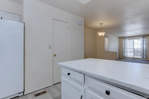 a room with a sink and mirror