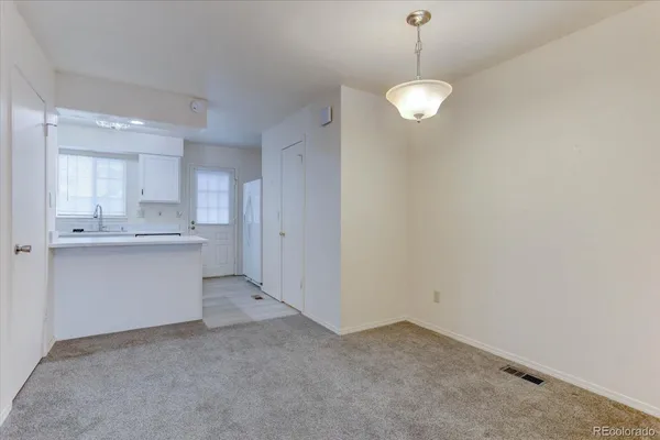 a view of a kitchen with a sink
