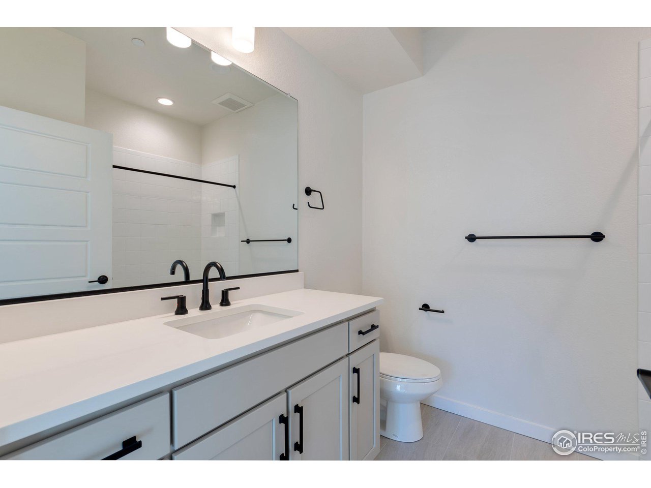 358 Promenade Drive Superior, CO 80027 - Photo 12 of 32 a bathroom with a sink toilet a mirror and shower
