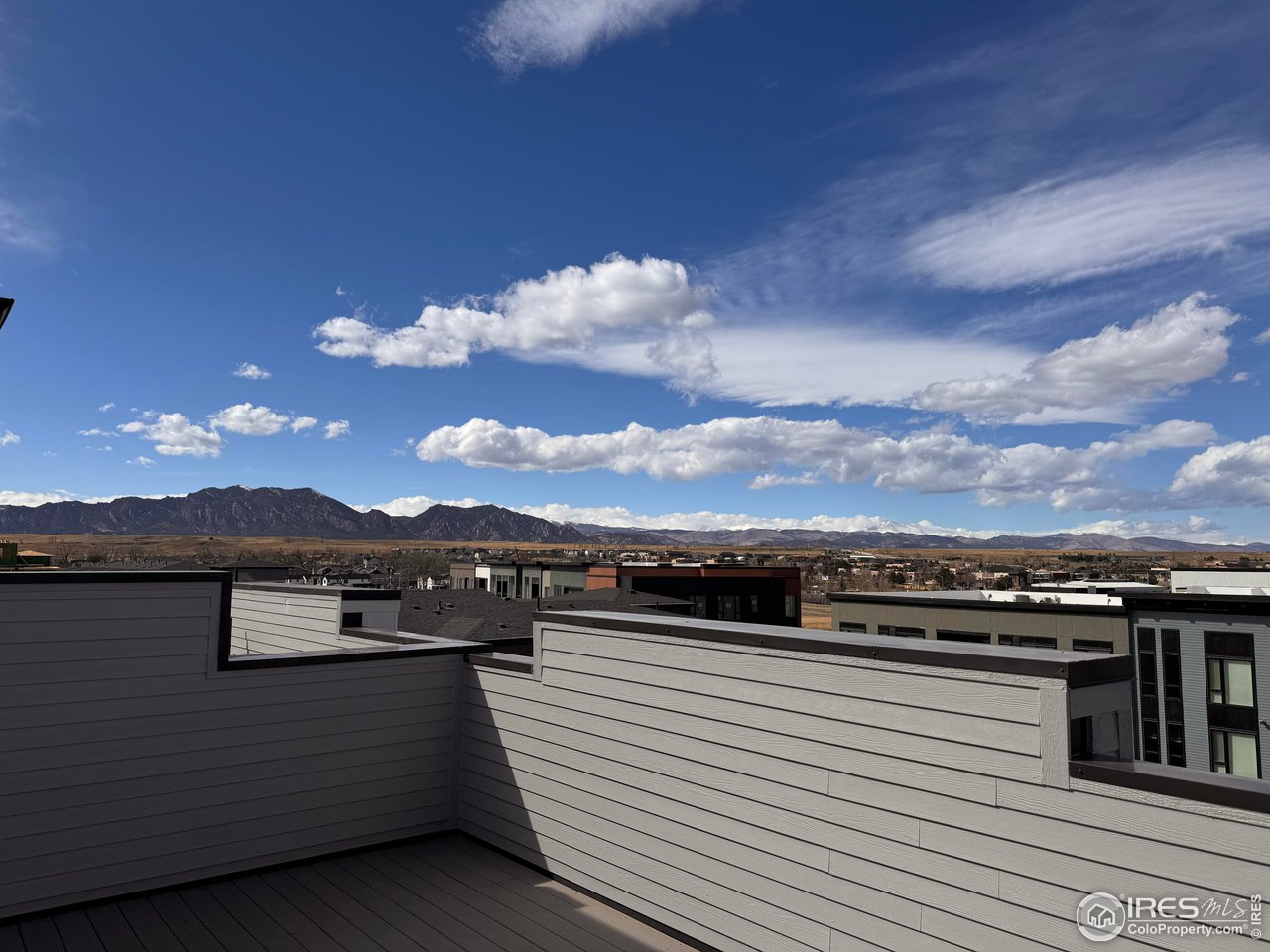 358 Promenade Drive Superior, CO 80027 - Photo 19 of 32 a view of a terrace with a mountain