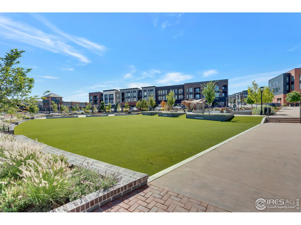 358 Promenade Drive Superior, CO 80027 - Photo 25 of 32 a view of a swimming pool and lounge chairs in back yard of the house