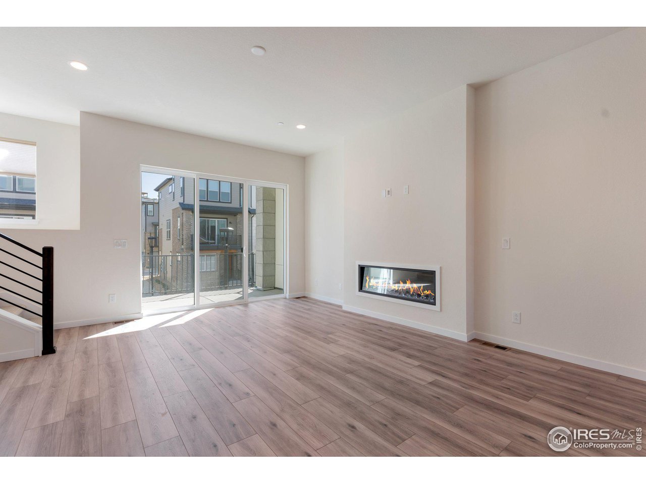 358 Promenade Drive Superior, CO 80027 - Photo 6 of 32 a view of an empty room with wooden floor and a window