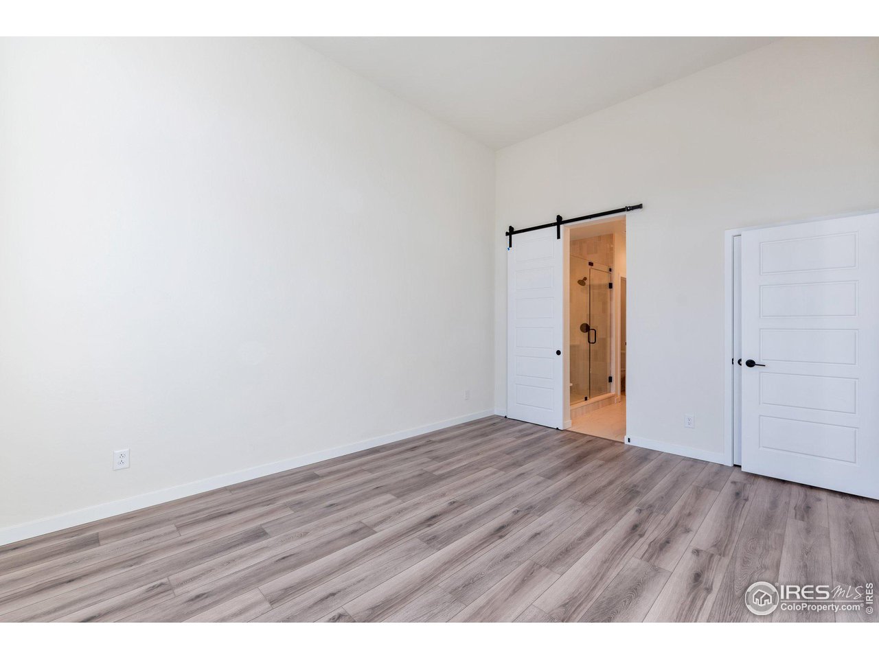 358 Promenade Drive Superior, CO 80027 - Photo 9 of 32 a view of an empty room with wooden floor