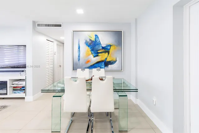 a view of living room with furniture and wall painting