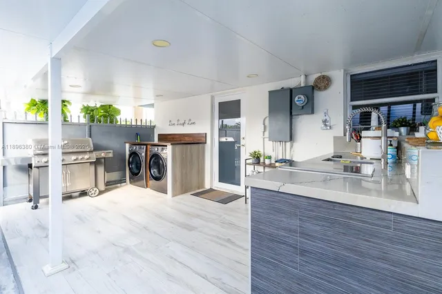 a view of kitchen and dining room with wooden floor