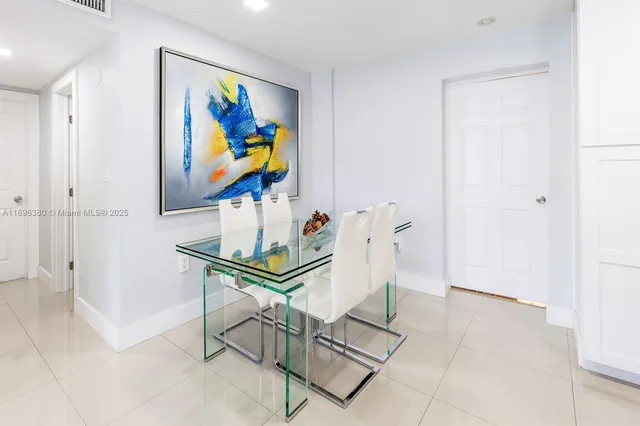 a view of dining room with furniture and wooden floor