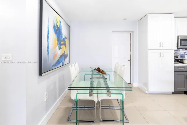 a room with gym equipment and view of living room