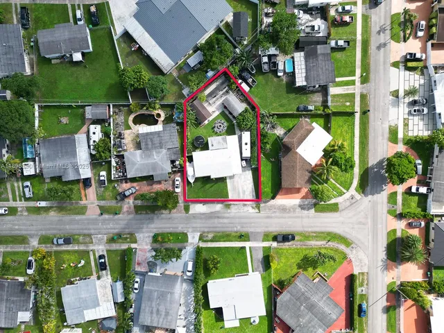 an aerial view of houses with outdoor space