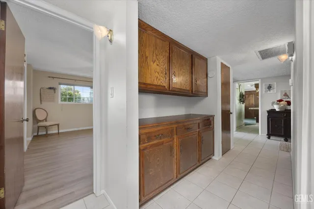 a view of a kitchen with cabinets and a wooden floor