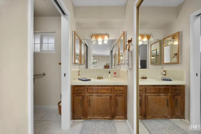 a bathroom with a sink a vanity and a mirror