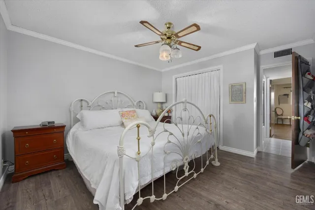 a bedroom with two beds and a chandelier